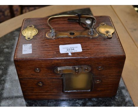 A 1950's unusual oak cased and brass internal, key, pigeon clock by the maker Jundes Thexor