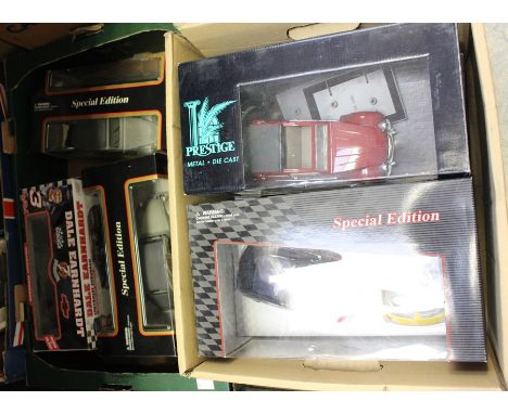 Two boxes of boxed modern toys, comprising seven models: Burago Citroen 2CV 1:18 (3); Dale Earnhardt Chevrolet Suburban; Smar