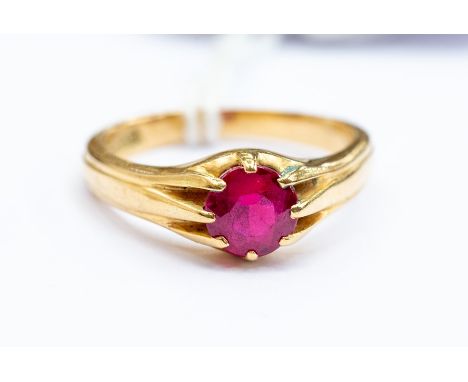 A synthetic ruby and 18ct gold gents ring, round cut stone claw set stone measuring approx. 6mm, size S1/2, total gross weigh