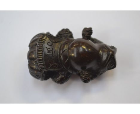 A treen netsuke of a standing frog, signed