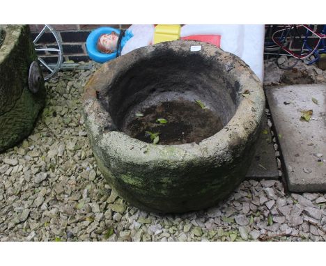 An 18th Century large carved circular limestone trough.