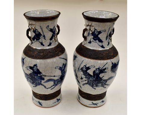 A pair of 20th Century Japanese large blue and white vases, depicting battle scenes