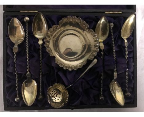 A cased silver salt strainer spoon; together with German spoons