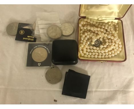 A quantity of crowns; together with pearl necklaces