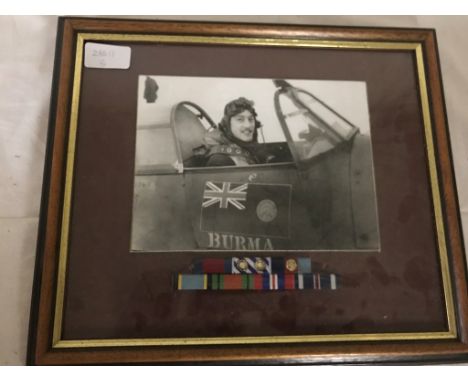 A portrait photograph of a pilot with medal bars: DSO, DFC