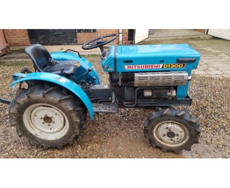 A Mitsubishi D1300 FWD tractor, high/low ratio, PTO, with a two wheel tipper trailer, two spare wheels/tyres, in working orde