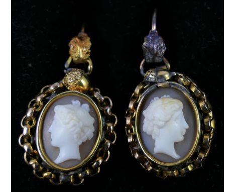 A Victorian pair of gold mounted shell cameo ear pendants, depicting a classical lady in profile, applied chain border, lengt