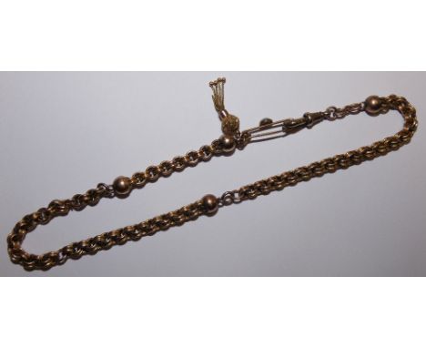 A Victorian 9ct rose gold fancy link chain with tassel fob, 18gms