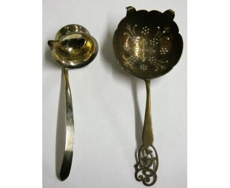 A silver sauce ladle, Sheffield 1938 and a silver tea strainer Sheffield 1936 (2)