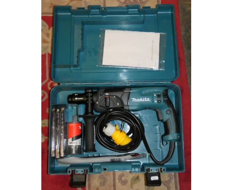 A Makita HR2470T rotary hammer drill, 110 volt, unused, case and accessories