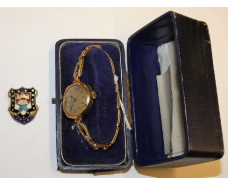 A 9ct rose gold ladies manual wind wristwatch London 1922, to an expanding bracelet 18.8gms, case