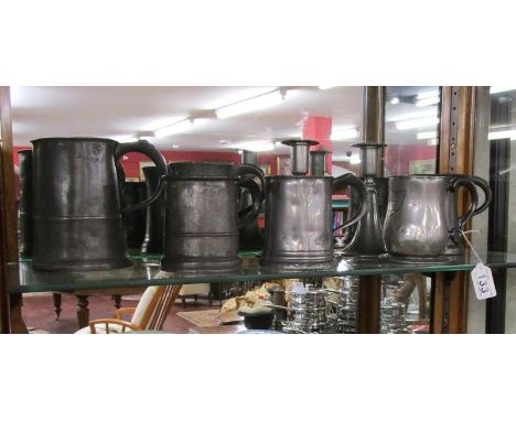 Shelf of pewter to include tankards &amp; candle sticks