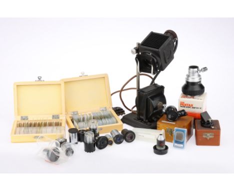 A Collection of Microscope Accessories, including a number of modern objectives, a Leitz lucida in a case, a number of petrol
