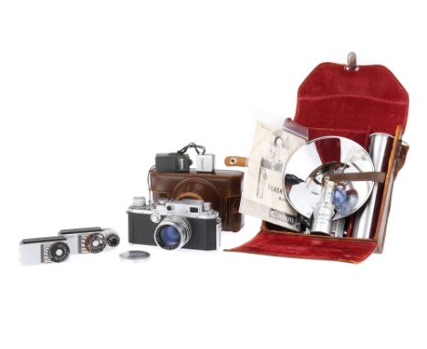 A Canon IV SB2 Rangefinder Camera and Accessories 1954-56, chrome, serial no.211695, with a Serenar f/1.8 50mm lens, serial n