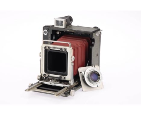 A Graflex Century Graphic Medium Format Press Camera grey, red bellows, 2¼ x 3¼in. format, circa 1953, serial no.522123, with