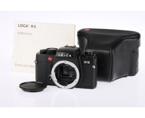 A Black Leica R5 35mm SLR Body, 1987, serial no.1716946, shutter button action uncertain, slow speeds issue, viewfinder indic