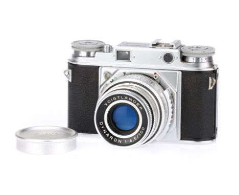 A Voigtlander Prominent 35mm Rangefinder Camera, chrome, body G, shutter working, RF patch clear, together with a Dynaron f/4