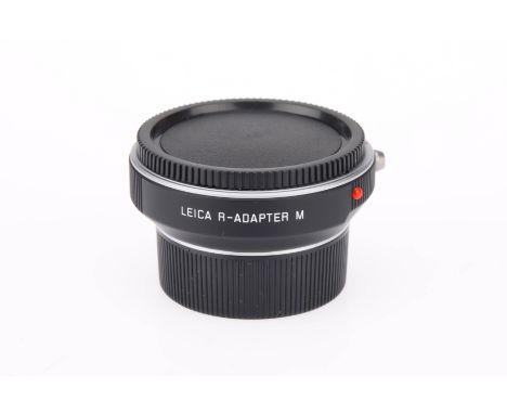 A Leica R-Adapter M 14642 Converter, complete with maker's caps