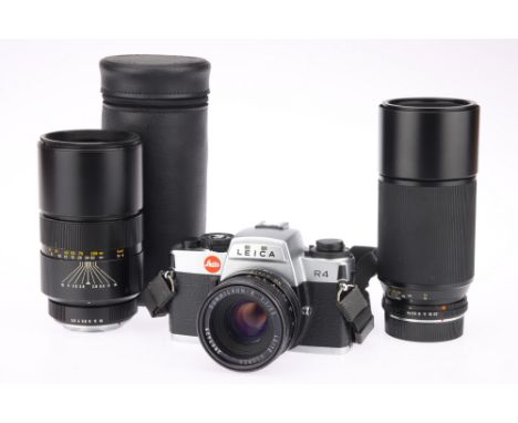 A Leitz Portugal Leica R4 35mm SLR Camera with Lenses chrome, 1982, serial no.1603684, with three lenses; a Leitz Canada Summ