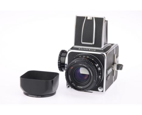 A Hasselblad 500CM Medium Format Camera, chrome, serial no. UT179745, with Carl Zeiss Planar T* f/2.8 80mm lens, black, seria