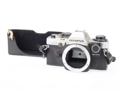 An Olympus OM10 SLR Camera Body, chrome, with Manual Adapter, body, G, shutter working