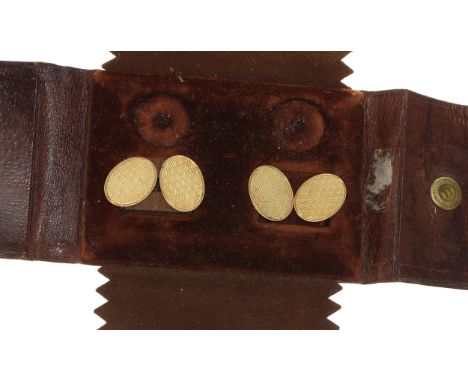 Pair of 18ct oval engine turned cufflinks, Birmingham 1923, 7.5g, 16mm&nbsp; ** with a tan leather case&nbsp; 