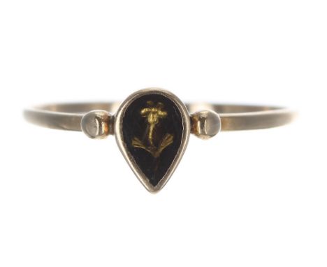 19th century yellow gold mourning ring, depicting a gold flower set in a pear shaped mount, width 6.5mm, 0.7gm, ring size J/K