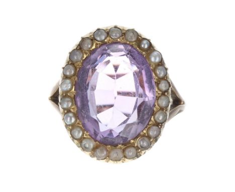 Amethyst and pearl oval cluster ring, the amethyst 6.40ct approx, in a band of seed pearl set in yellow gold, 20mm x 16mm, 6.