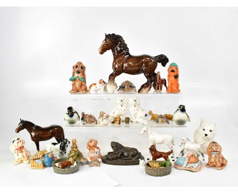 A quantity of porcelain and pottery, mainly animal figures including a Beswick Shire horse, various Wade whimsies, Pendelfin 
