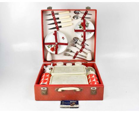 A Brexton four-setting picnic set in red case, including Royal Tudor Ware teacups, saucers and side plates decorated with red