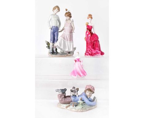 LLADRÓ; two porcelain figure groups, one depicting a boy and girl, height 29cm, the other of a boy lying reading with puppy, 
