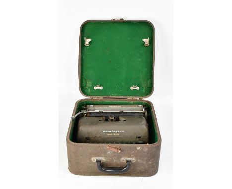 REMINGTON; a vintage 'Quiet-Riter' typewriter in case, case approx. 18 x 38 x 37cm.