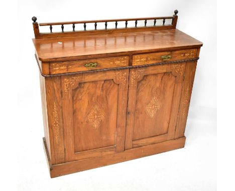 A Victorian inlaid walnut chiffonier with a turned galleried back, two short drawers above a pair of cupboard doors and on a 