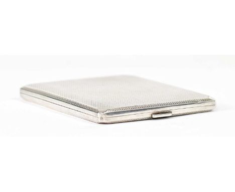 ADIE BROTHERS LTD; a George V hallmarked silver cigarette case with gilt interior and engine turned decoration, Birmingham 19
