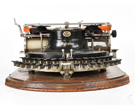 HAMMOND; an early 20th century 'Multiplex' typewriter with curved keyboard, in wooden case, with information sheet to lid int