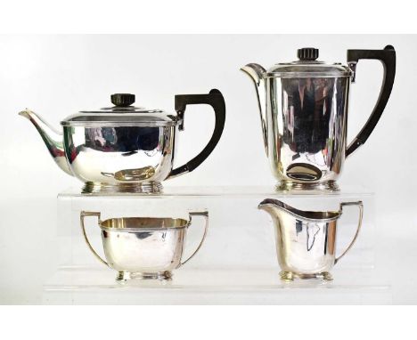 HARRISON BROTHERS &amp; HOWSON; a George VI hallmarked silver Art Deco tea service, comprising teapot and water jug, with ebo