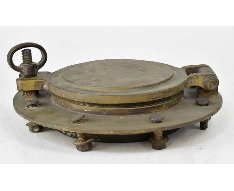 A vintage brass porthole, with eight flange bolts and hinged cover with threaded clasp, glass diameter 14.5cm, overall diamet