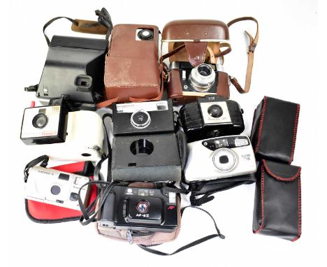 Various cameras including a Polaroid Land Camera Swinger Model 20, a Voigtlander, a Kodak Brownie 127, a Kodak Instant camera