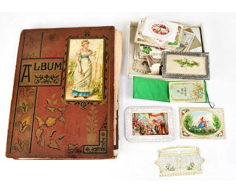 A Victorian album containing c.1880s and later postcards, greeting cards and scraps, etc, including Christmas, Birthday, new 