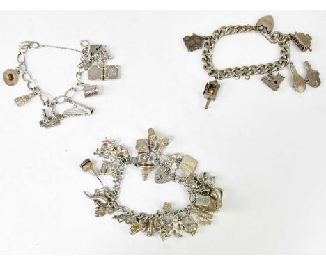 Three hallmarked silver charm bracelets set with silver and white metal charms, comprising an example set with five charms, i
