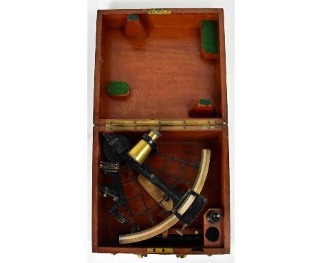 A wooden cased sextant.