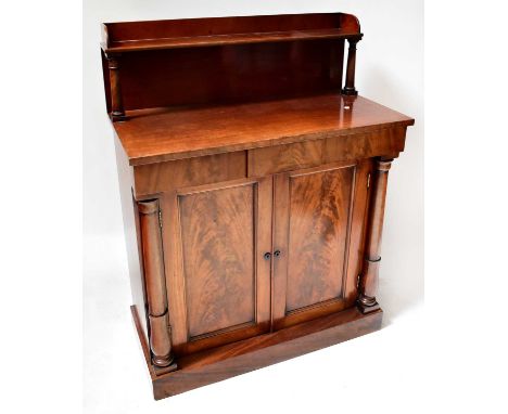 A Victorian mahogany chiffonier with galleried top, on turned supports, above a base with a frieze drawer and pair of cupboar