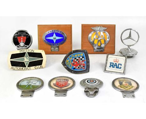 Eleven car mascot badges, radiator grille badges and car association badges, including the AA, RAC, Mercedes, Rover Owners As