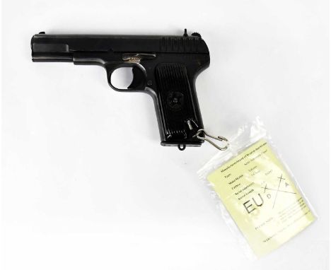 TOKAREV; a deactivated 7.62mm Russian semi-automatic pistol with spare magazine and leather holster, overall length 19.5cm. S