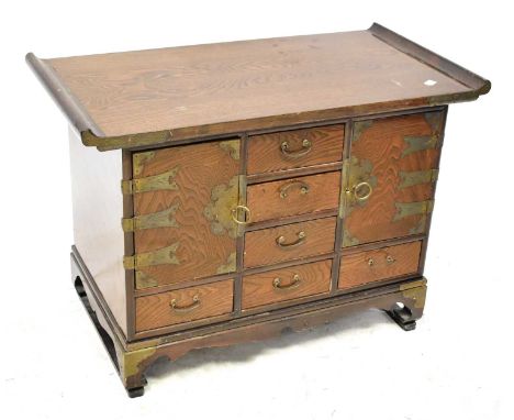 A Korean elm collector's or apothecary cabinet, with an arrangement of six small collectors' drawers and pair of cupboard doo
