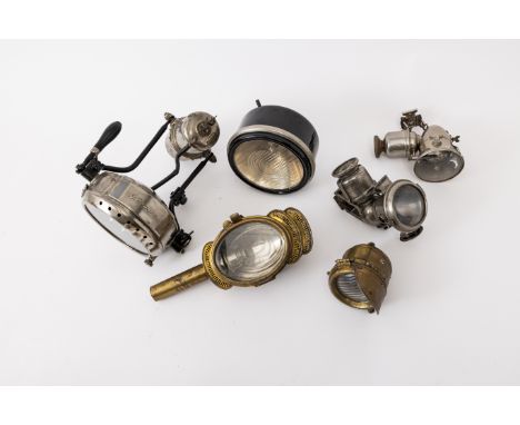 Assorted lamps,including a Carrier 'Le Sum' acetylene bicycle lamp and a Riemann motorcycle headlamp, acetylene with bracket 