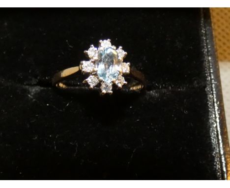 9ct Gold dress ring set with 8 diamonds &amp; central topaz Size R