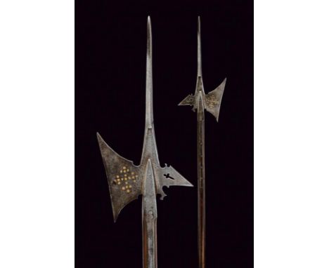 dating: Late 16th Century provenance: Swiss, Solid cusp of lozenge section. Oblique-edge axe with narrow base and decorated w
