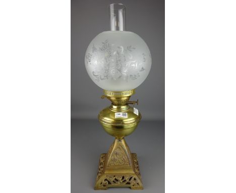 Oil lamp with cast iron pierced base and glass shade, H57cm including funnel    Condition Report   Click here for further ima