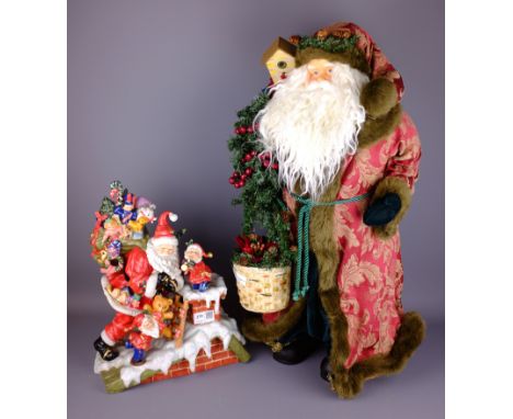 Christmas model of standing Santa Claus, H62cm and a ceramic Santa Claus delivering presents (2)   Condition Report   Click h